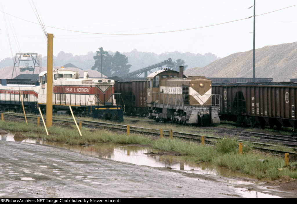 Texas & Northern S2 #24 and MP15DC #999 with slug #2 work yard.